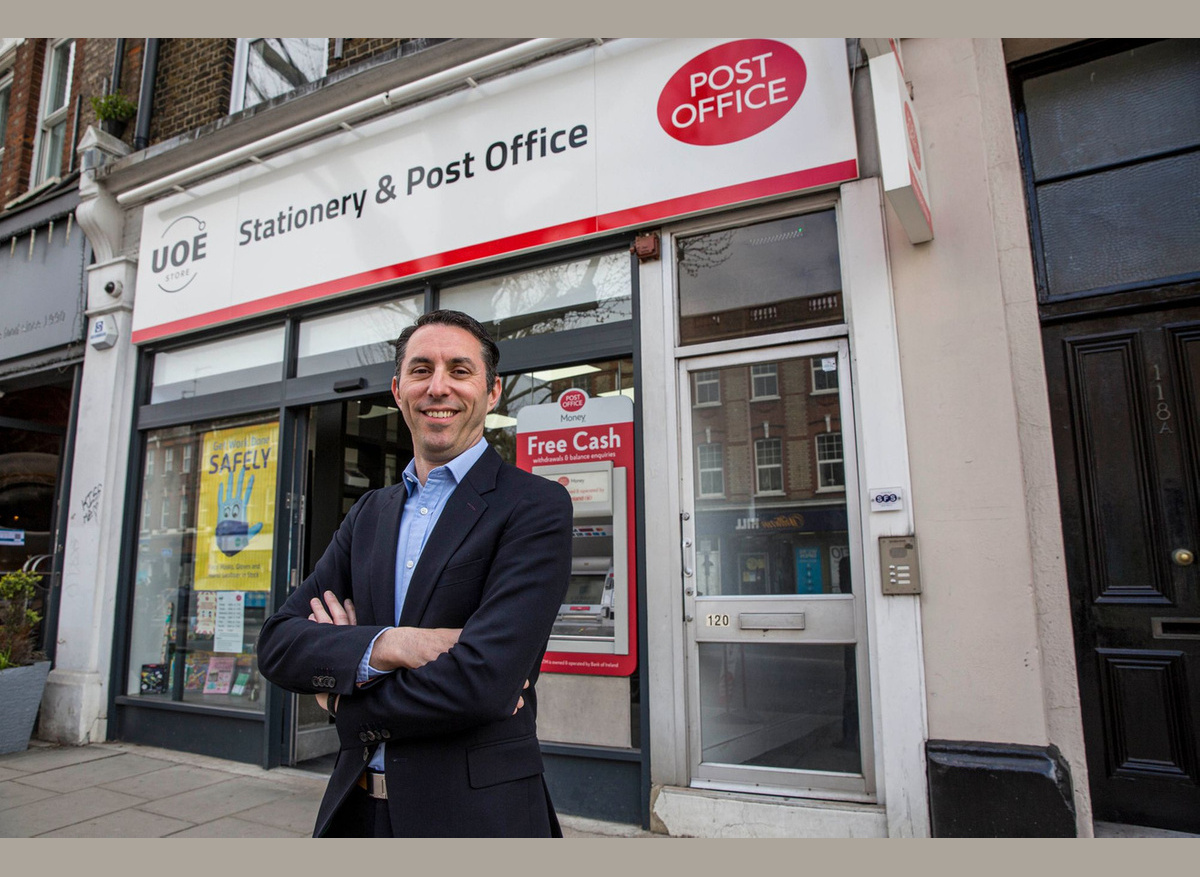 Postmaster Elliot Jacobs, outside one of his UOE branches