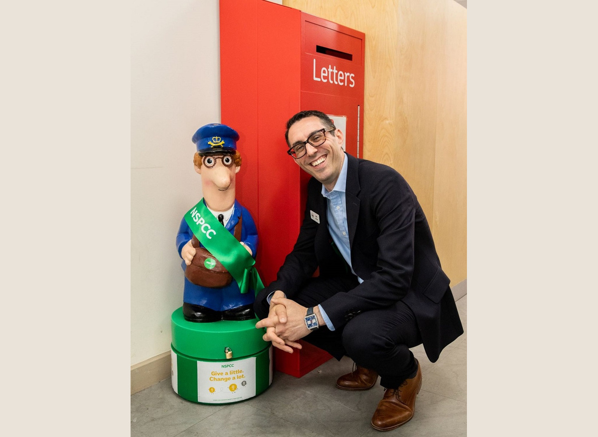 Elliot Jacobs, MD, UOE & Postman Pat in the Hertford Post Office and UOE Store